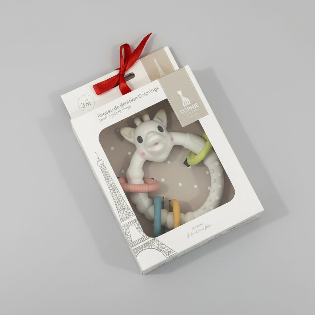 Teething toy in packaging on a festive patterned background