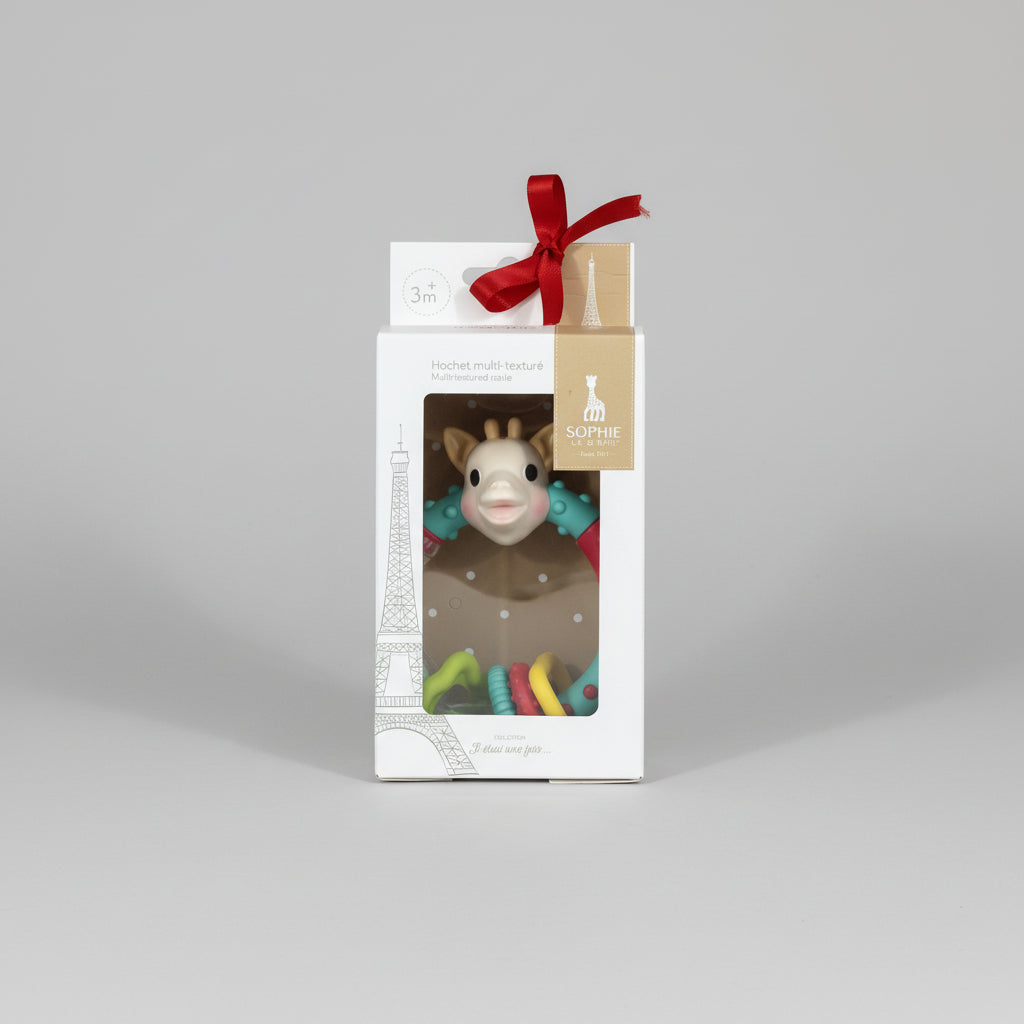 Toy in a box with a tag on a festive patterned background