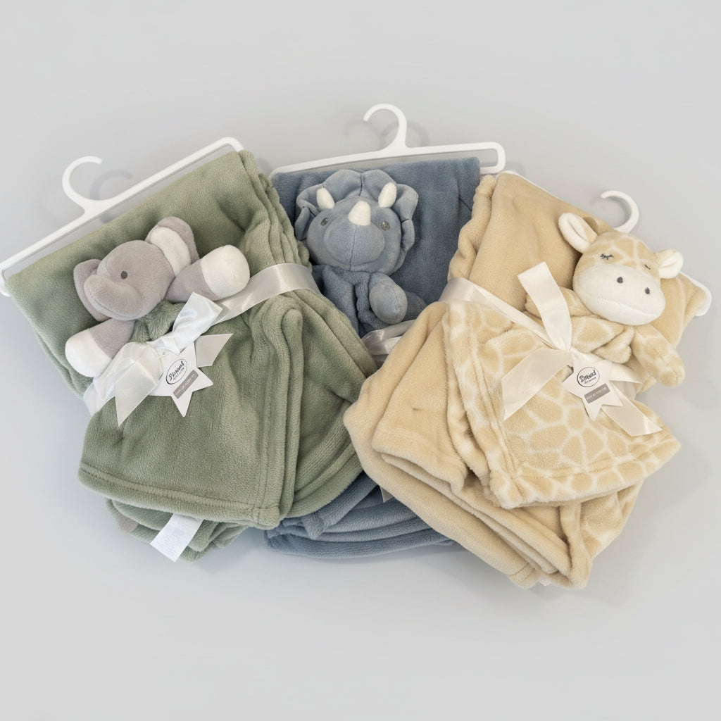 Three plush animal blankets on a hanger , colors green , blue , beige in a simple grey background.