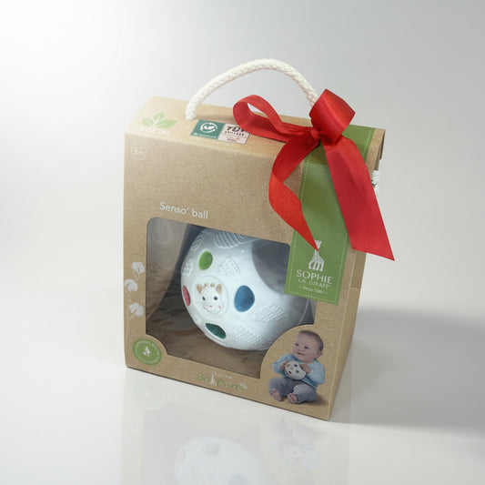 Sophie the Giraffe baby teething ball in a gift box on a grey background.