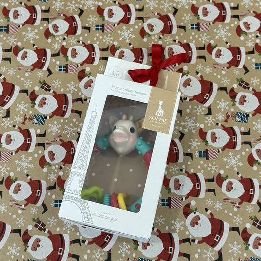 Toy in a box with a tag on a festive patterned background